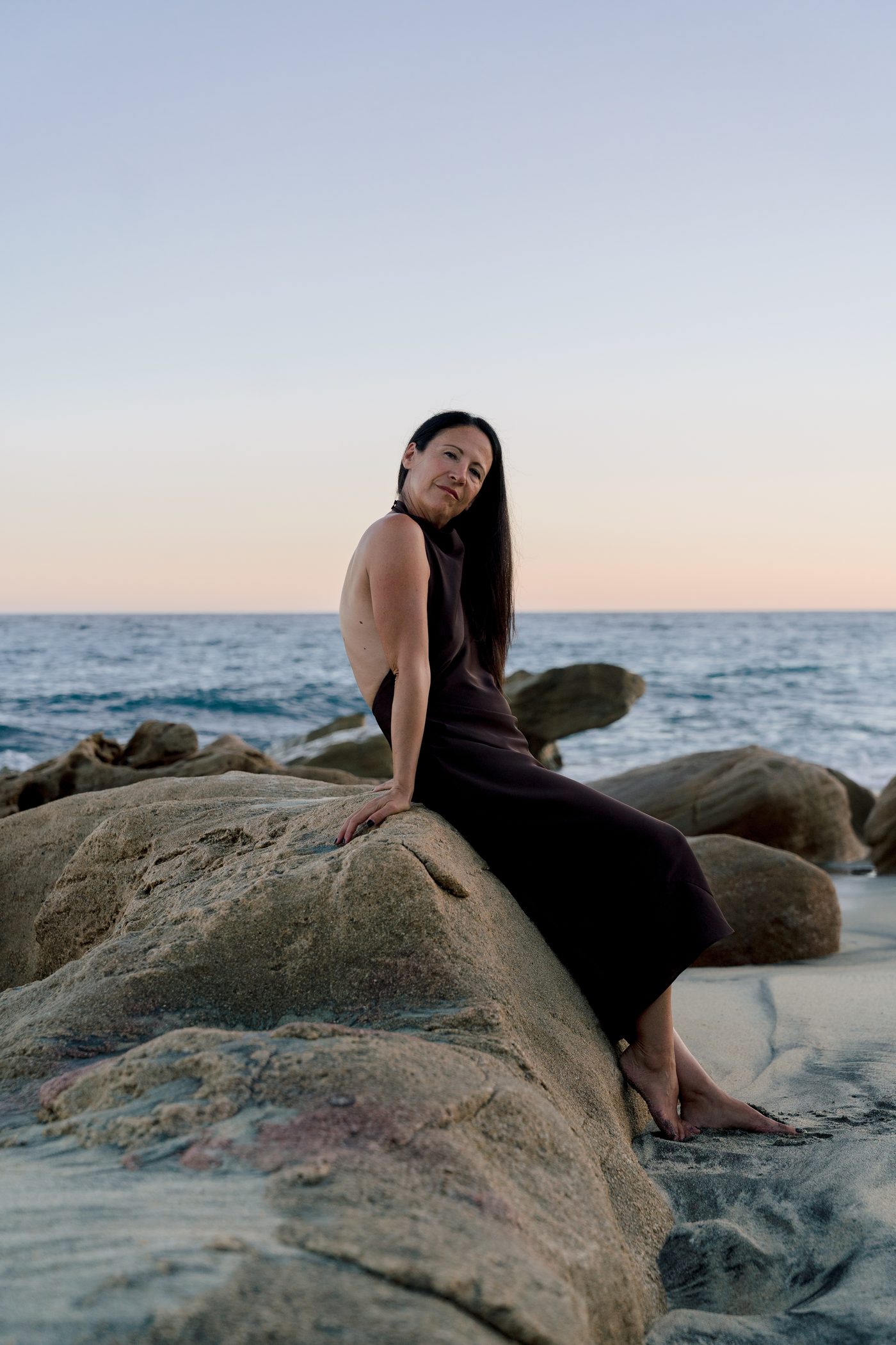 Lisa Axford walking the beach at sunset